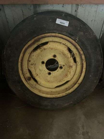 Used Tractor Tire with Yellow Rim image