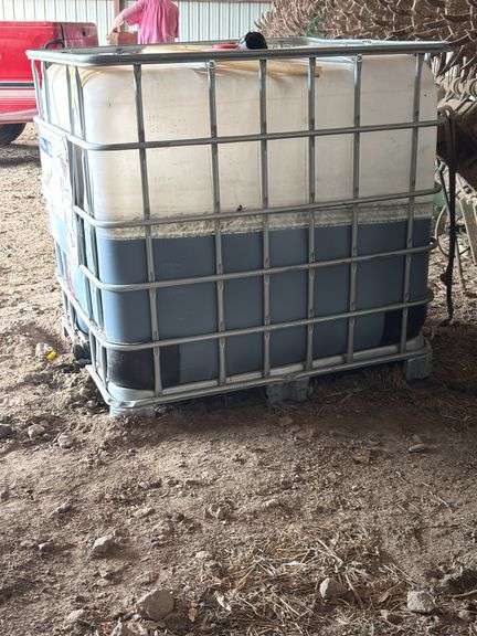Schutz chemical tote, 265 gallons, approx 1/2 full, Helmquat 3SL image