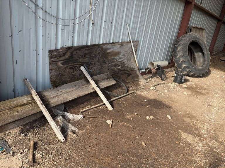 Assorted Farm Related Items: Tire, Wood, Pallet, Pipe (south wall) image