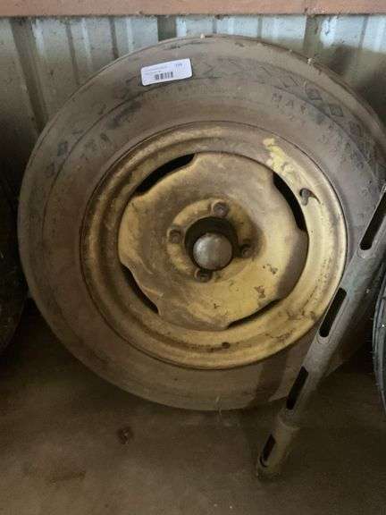 Used Tractor Tire with Yellow Rim image