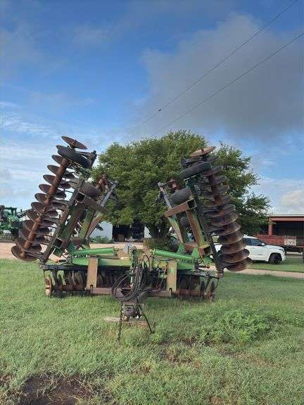 1997 JD 650 Disk Harrow, 30 ft, dual wheels, 3 bar harrow attached (1 section damaged), Serial #N00650X001500 image