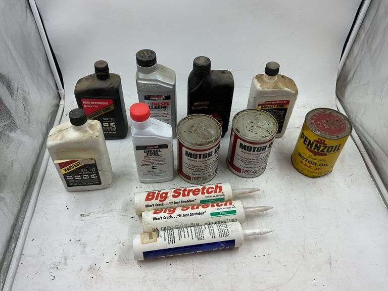 Assorted Motor Oils, Diesel Fuel Supplement and Big Stretch Caulking Tubes image