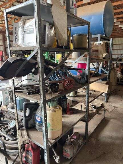 Metal Shelving Units with Various Oils, Chemicals, and Parts image