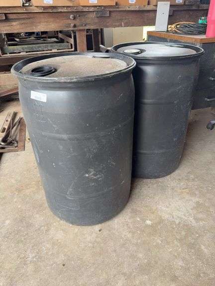Two Black Plastic 25-Gallon Barrels / Drums image
