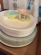 Assorted Party Supplies: Paper Plates, Napkins, Cups, and Cupcake Liners