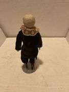 Porcelain Doll in Brown Outfit