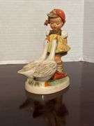 Collection of Goebel Hummel Figurines and Floral Decoration