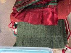 Variety of Fabric and Textile Pieces in Container