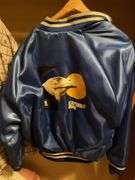 Assorted Apparel: USPS Bomber Jacket, Cabela's Shirt, and Bobcat Pants