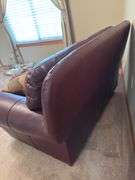 Burgundy Leather Loveseat with Throw Pillows
