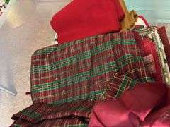 Variety of Fabric and Textile Pieces in Container
