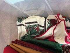 Variety of Fabric and Textile Pieces in Container