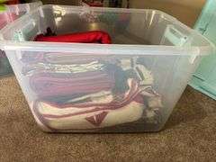 Variety of Fabric and Textile Pieces in Container