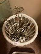 Assorted Household Items: Glass, Baskets, and Picture Hangers