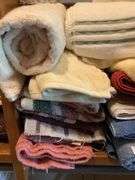Mixed Lot of Household Linens, Hangers, and Paper Products