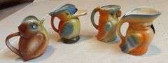 Set of Four Bird Themed Creamer Pitchers