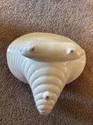 Red Glass Vase, White Ceramic Conch Shell Planter, and Pair of White Candle Holders