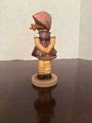 Collection of Goebel Hummel Figurines and Floral Decoration