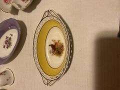 Collection of Decorative Plates and Bell