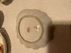 Collection of Decorative Plates and Bell