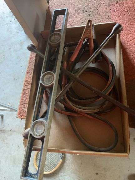 Box of Assorted Tools: Level, Jumper Cables, and Lug Wrench image
