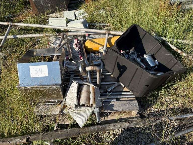 Stainless Steel Scrap Pieces in Two Piles and Additional Random Pieces image