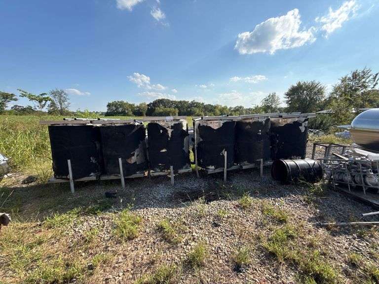 Industrial Tanks With Black Insulation and Metal Frames image