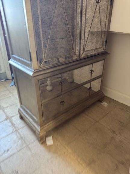 Gold armoire with glass front doors