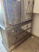 Gold armoire with glass front doors