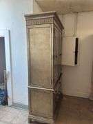 Gold armoire with glass front doors