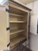 Gold armoire with glass front doors