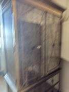 Gold armoire with glass front doors