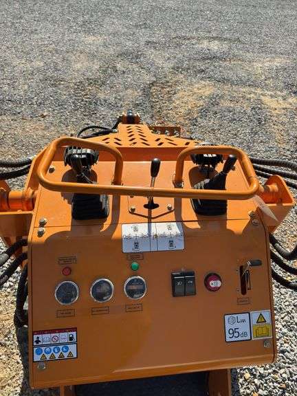 Unused Land Honor Stand on Mini Skid Steer