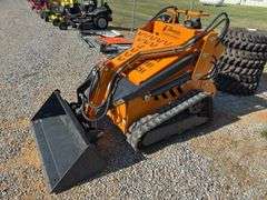 Unused Land Honor Stand on Mini Skid Steer