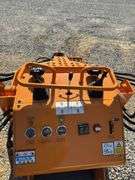 Unused Land Honor Stand on Mini Skid Steer