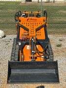 Unused Land Honor Stand on Mini Skid Steer