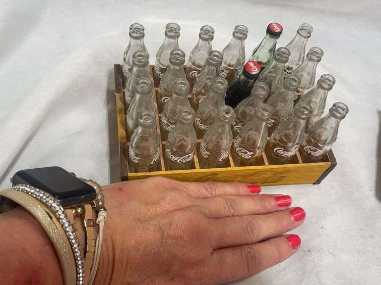 Coca-Cola Collectibles: Wooden Crate with Bottles and "Evolution of Contour Bottle" Set
