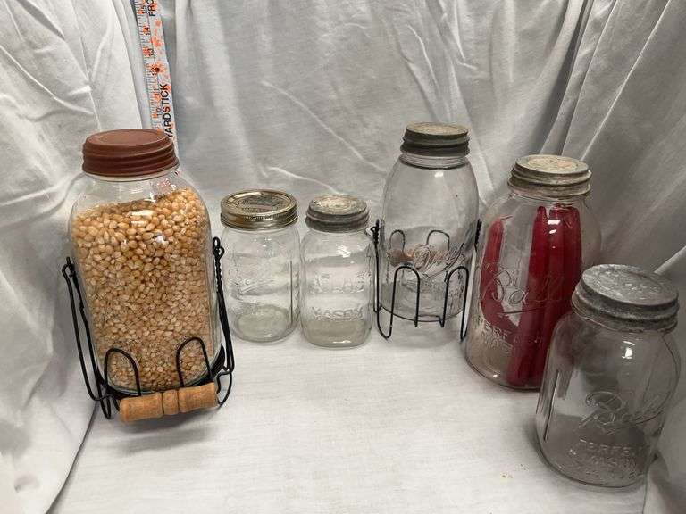 Group of Decorative Glass Mason Jars with Wire Holders image