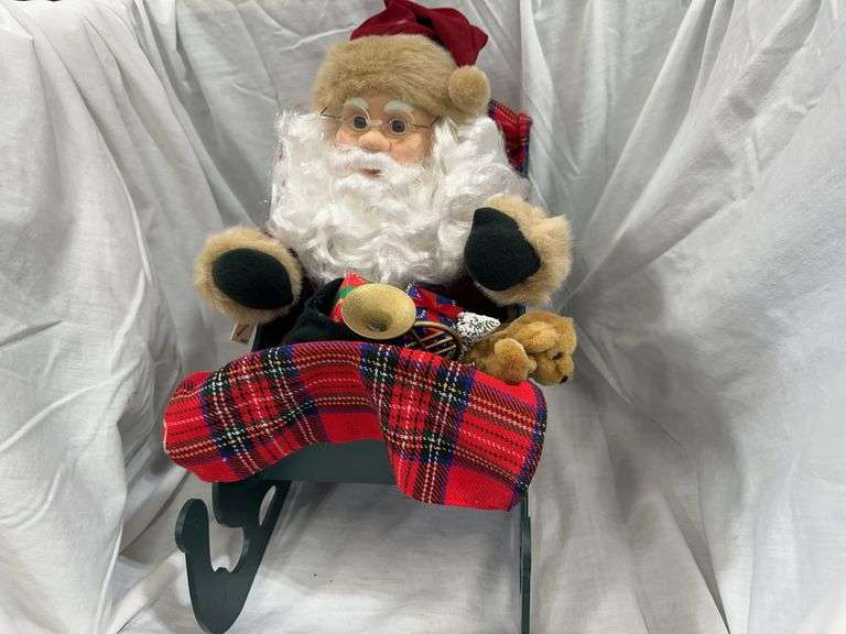 Collectible Santa Figurine in Decorative Sleigh with Plush Dog image