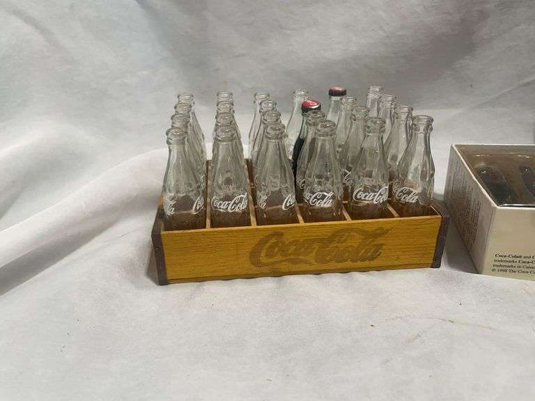 Coca-Cola Collectibles: Wooden Crate with Bottles and "Evolution of Contour Bottle" Set