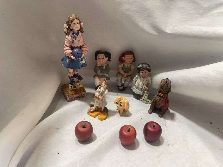 Collection of Figurines Featuring Girls, Animals, and Fruit image