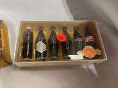 Coca-Cola Collectibles: Wooden Crate with Bottles and "Evolution of Contour Bottle" Set