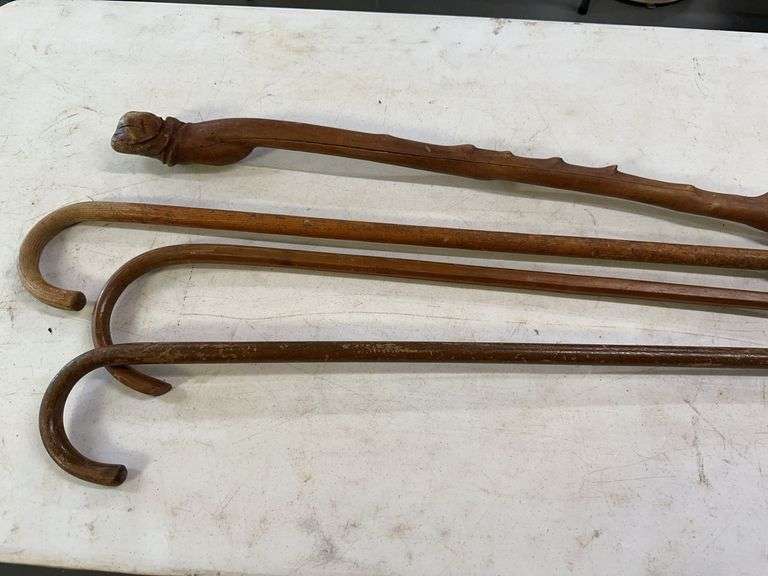 Lot of Four Wooden Walking Sticks image