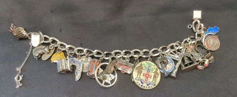 Sterling silver charm bracelet with 9 sterling charms