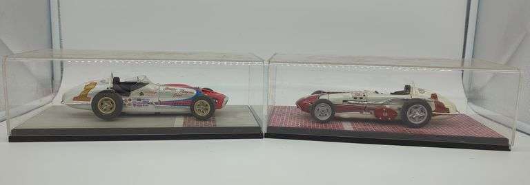 2 carousel 1 die cast race cars in display case image