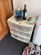 Organizers with pool care, shop rags towels and household miscellaneous