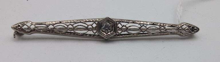14K white gold filigree style diamond brooch. image
