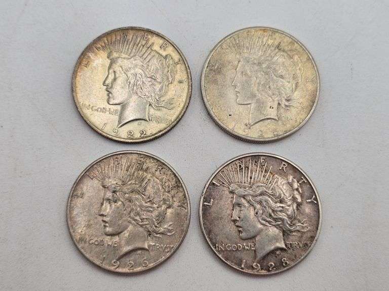four Silver Peace Dollars 1922, 1925, 1926-S, 1928-S image