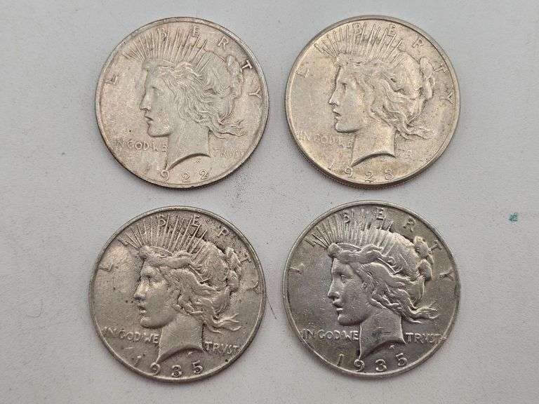 four Silver Peace Dollars 1922, 1923-S, 1935-S, 1935-S image