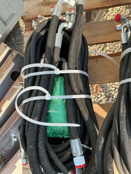 Bundle of assorted hydraulic hoses image